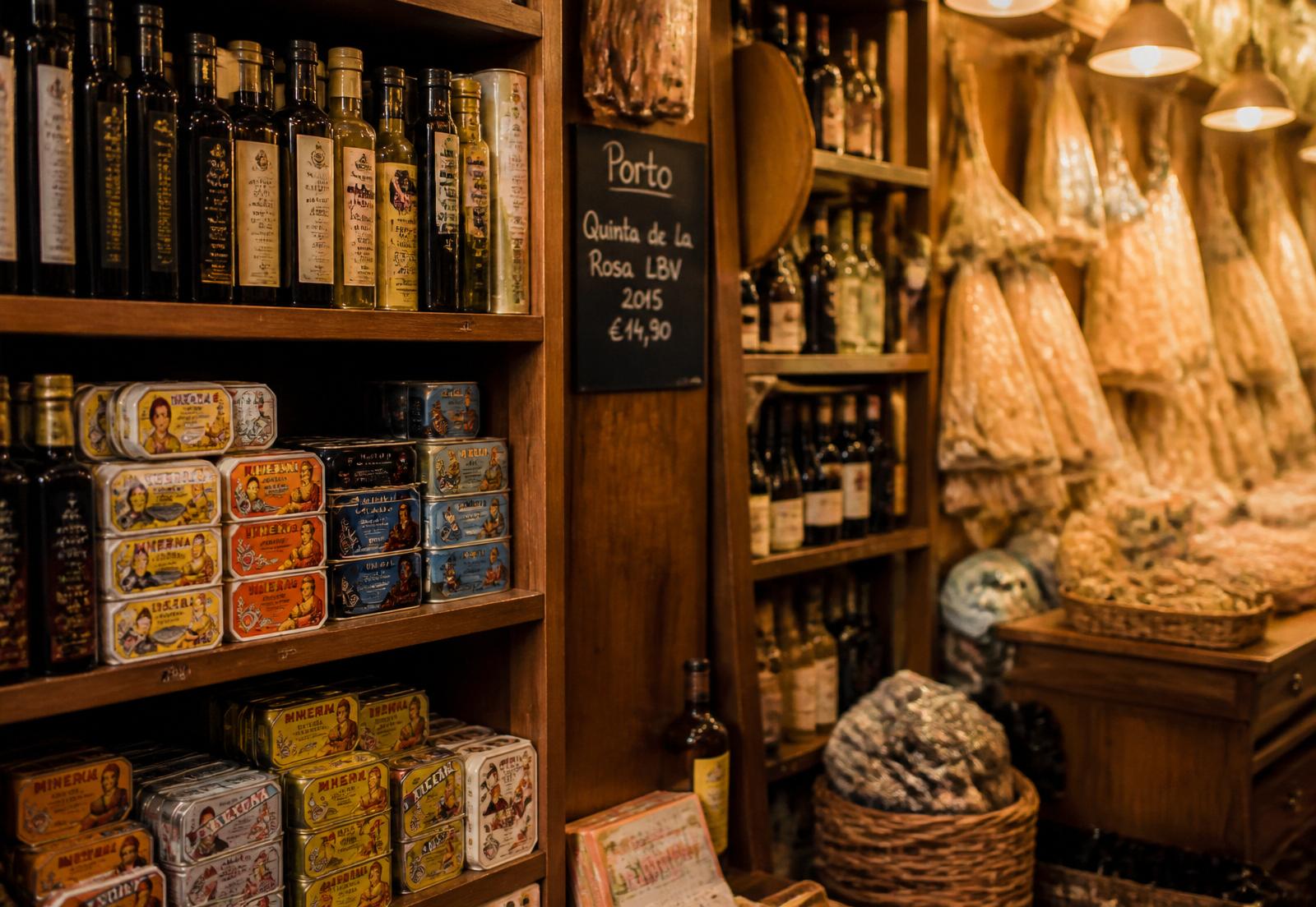 Shelves of Portuguese olive oil, tinned sardines and Port wine inside the store